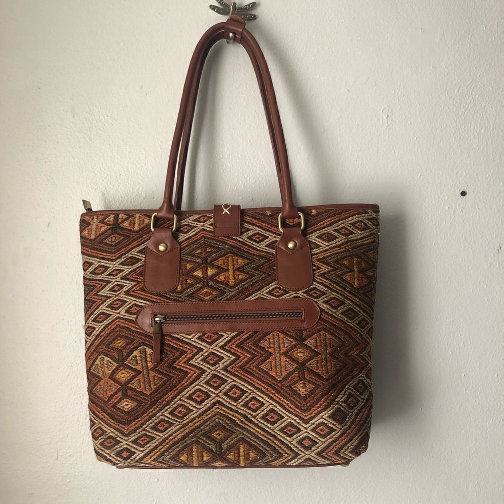 The Loom Alaska woven carpet bag with leather trim in natural colors